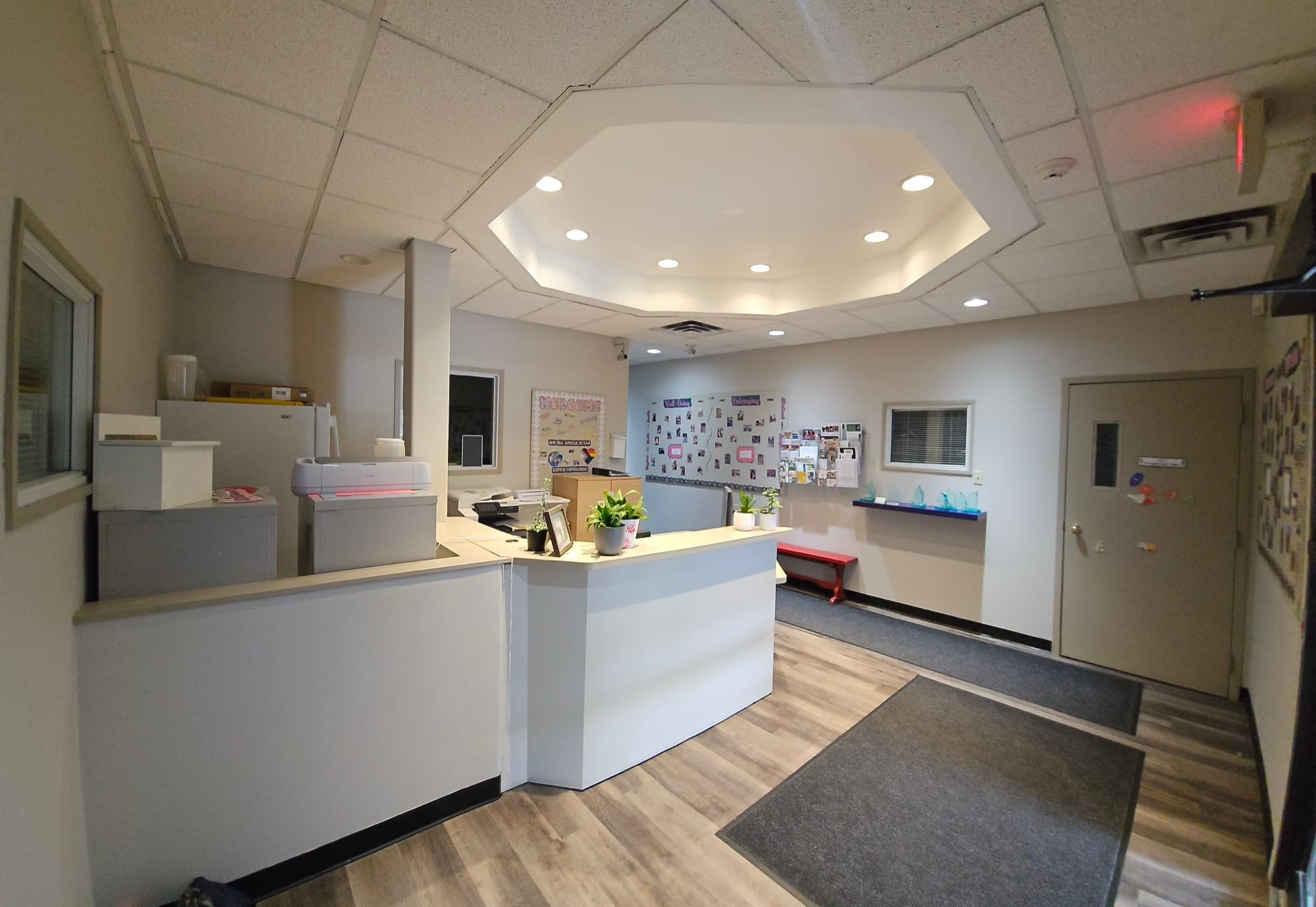 Reception area at KidLogic Oakville with the front desk and secure entry door